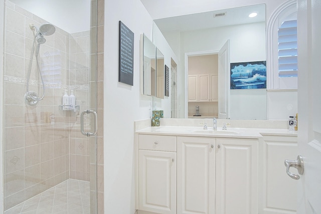 bathroom with vanity and walk in shower