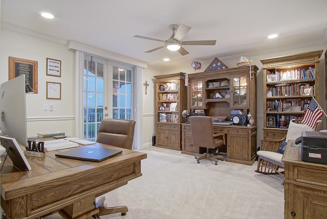 home office with french doors, ornamental molding, light colored carpet, and ceiling fan