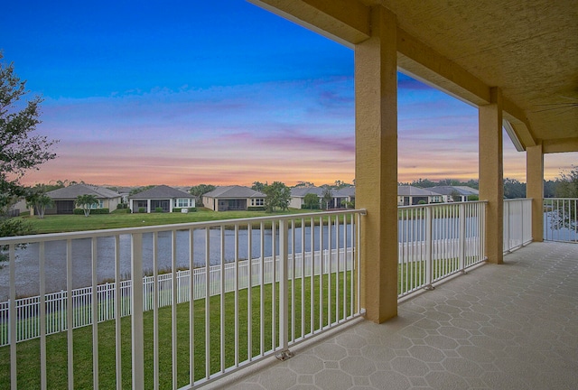 balcony at dusk with a water view