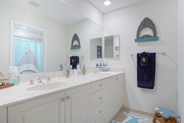 bathroom featuring vanity and tile patterned floors