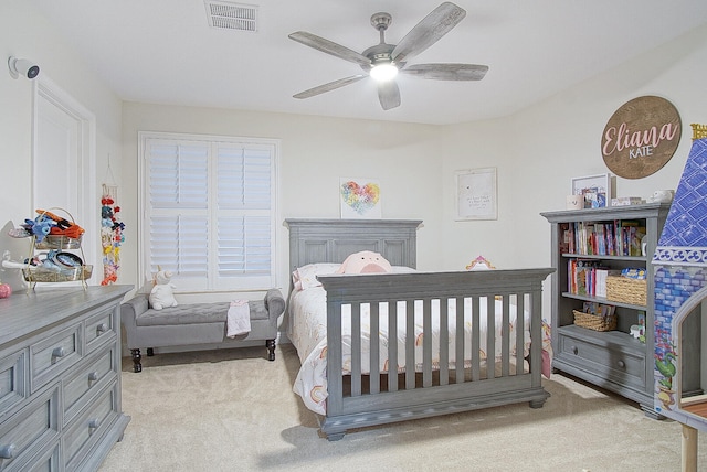 bedroom featuring ceiling fan and light colored carpet