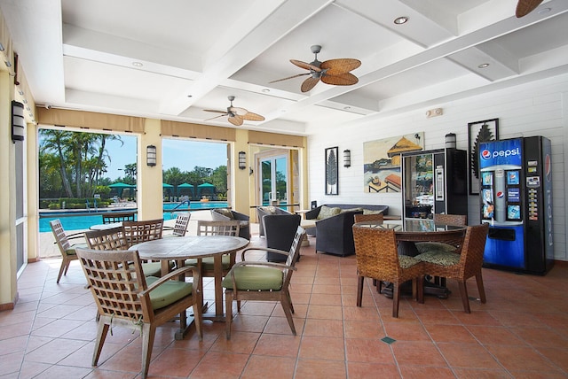 dining space with beamed ceiling, tile patterned floors, coffered ceiling, and ceiling fan