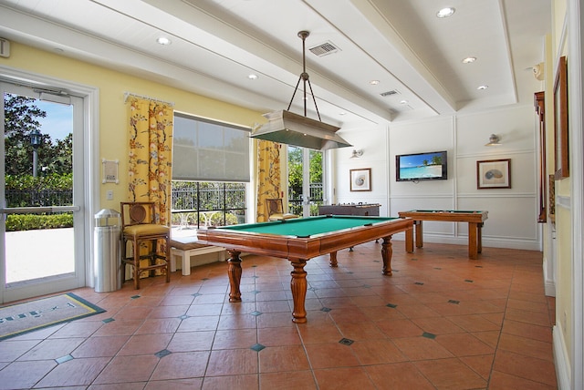 recreation room featuring billiards, beamed ceiling, a wealth of natural light, and dark tile patterned floors