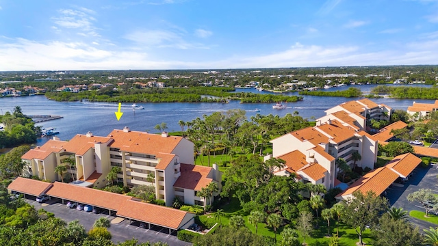 birds eye view of property with a water view