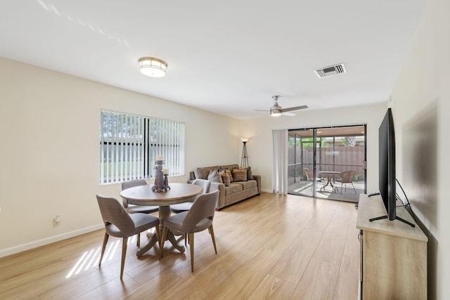 dining room featuring light hardwood / wood-style floors and ceiling fan