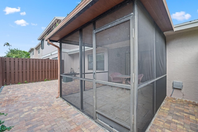 view of side of home featuring a patio area