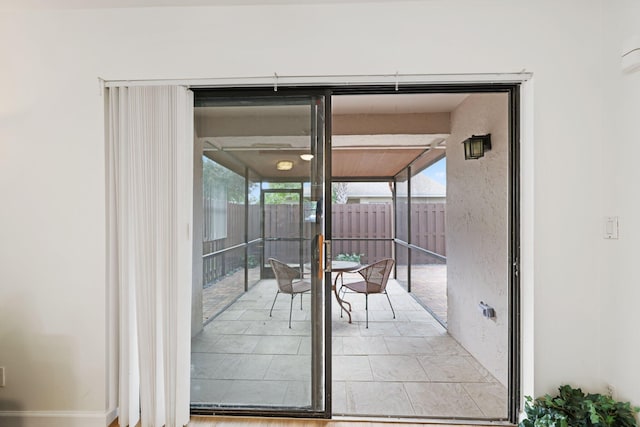 doorway featuring light tile patterned floors