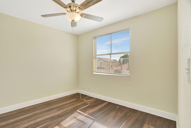 unfurnished room with ceiling fan and dark hardwood / wood-style flooring