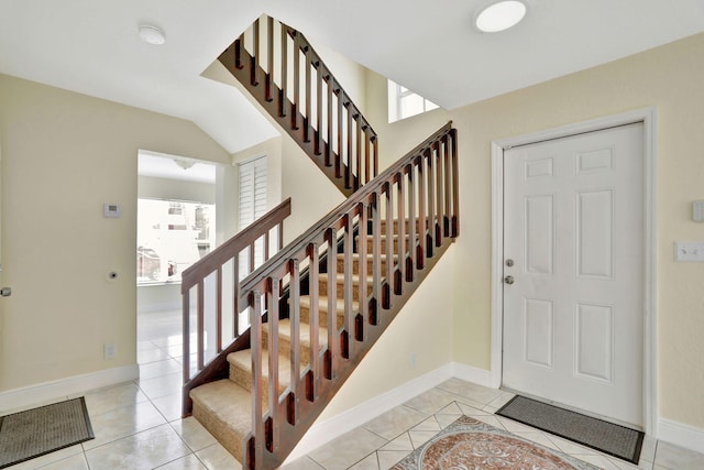 tiled entryway featuring a healthy amount of sunlight