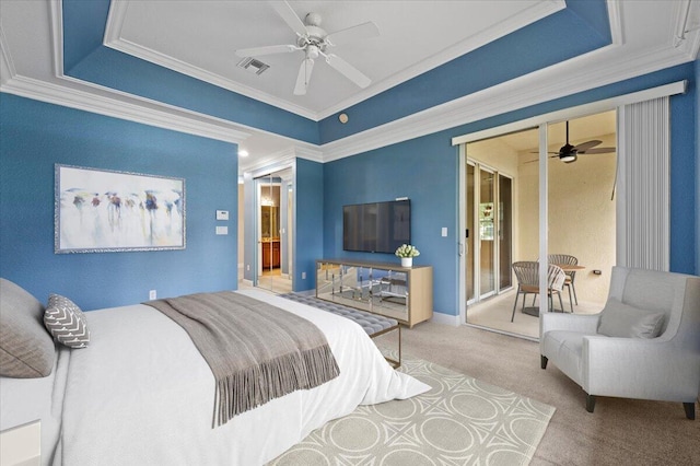 carpeted bedroom with ceiling fan, a raised ceiling, and ornamental molding