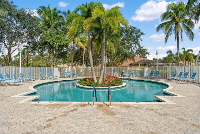 view of swimming pool featuring a patio area