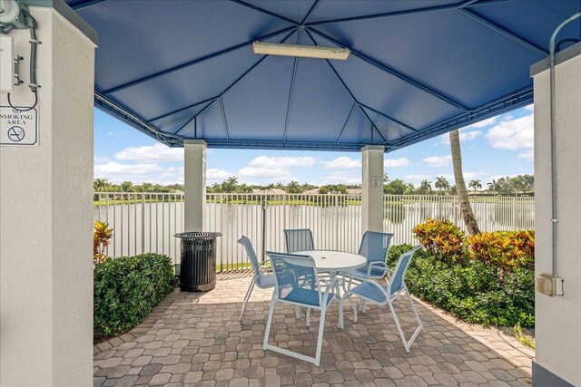 view of patio / terrace with a water view