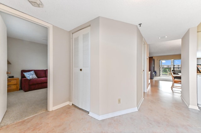 hallway featuring light carpet