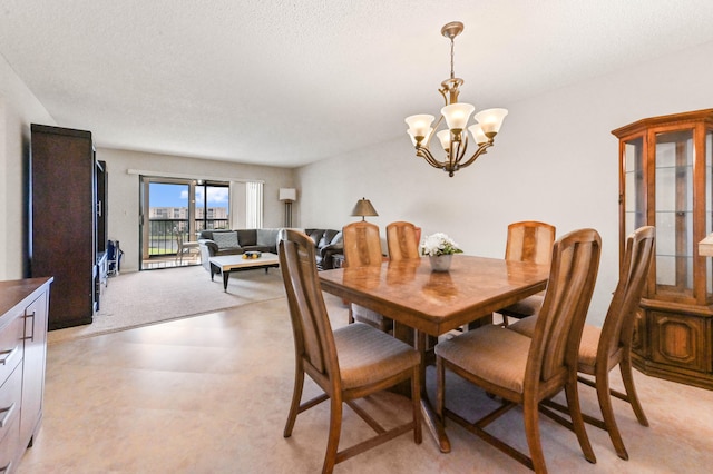 dining area featuring an inviting chandelier