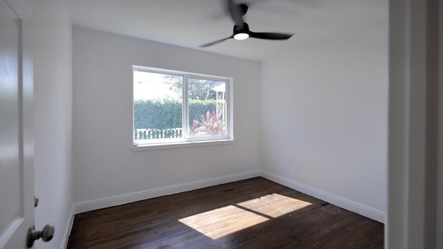 unfurnished room featuring ceiling fan and dark hardwood / wood-style floors