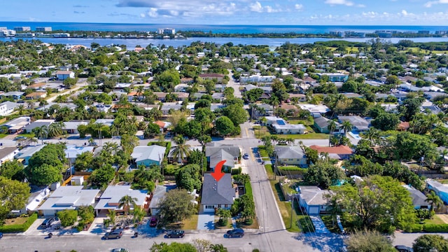 birds eye view of property featuring a water view