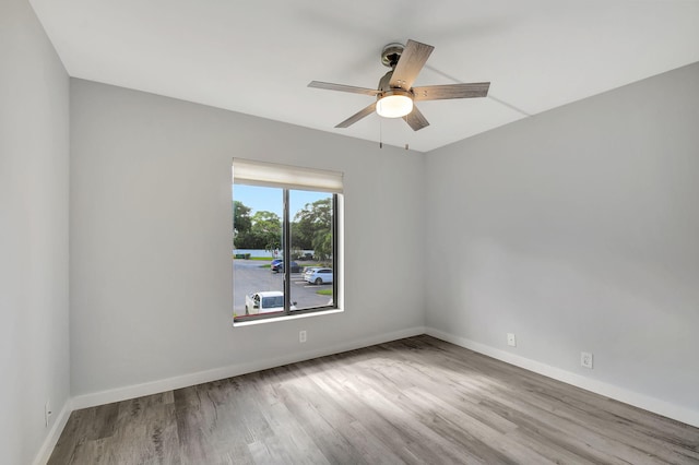 811 Sky Pine Way Unit D2, Greenacres, FL 33415 - spare room featuring a ceiling fan, wood finished floors, and baseboards