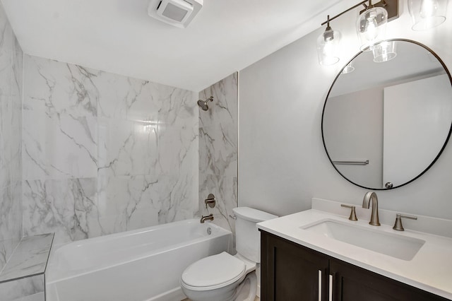 full bathroom with vanity, toilet, and tiled shower / bath