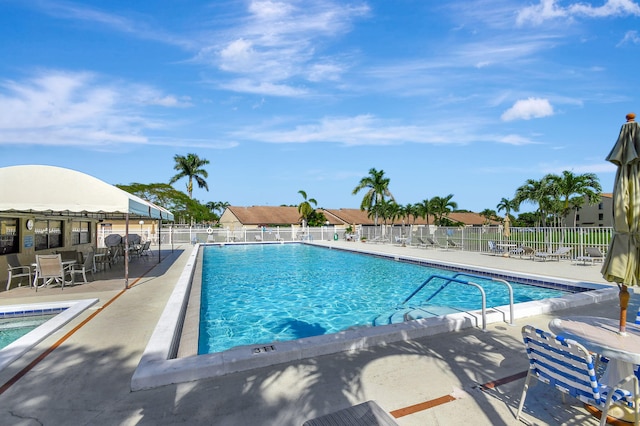 811 Sky Pine Way Unit D2, Greenacres, FL 33415 - community pool featuring a patio area