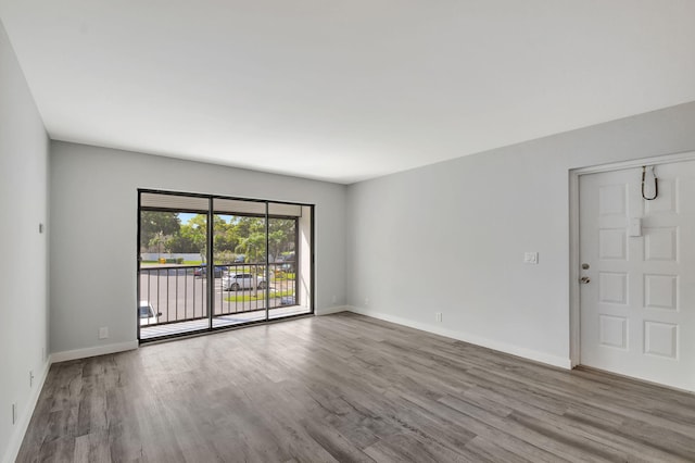 unfurnished room featuring light hardwood / wood-style flooring