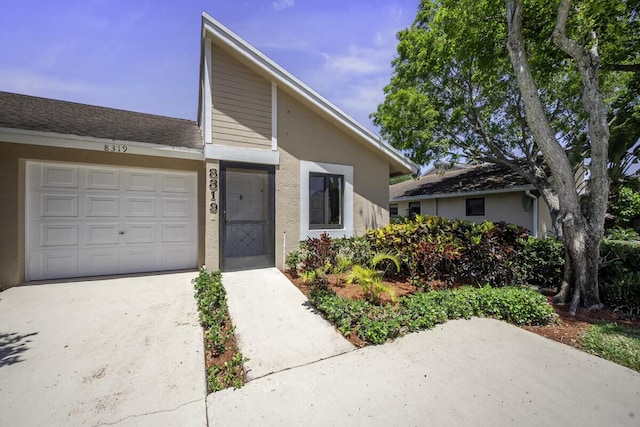 view of front of home with a garage