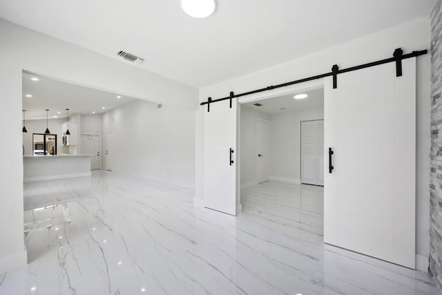 empty room featuring a barn door