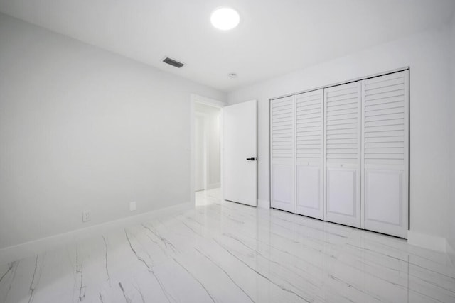 unfurnished bedroom featuring a closet