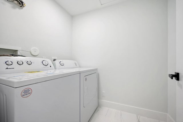 laundry room with separate washer and dryer