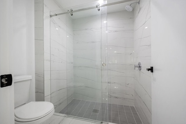 bathroom with toilet and walk in shower