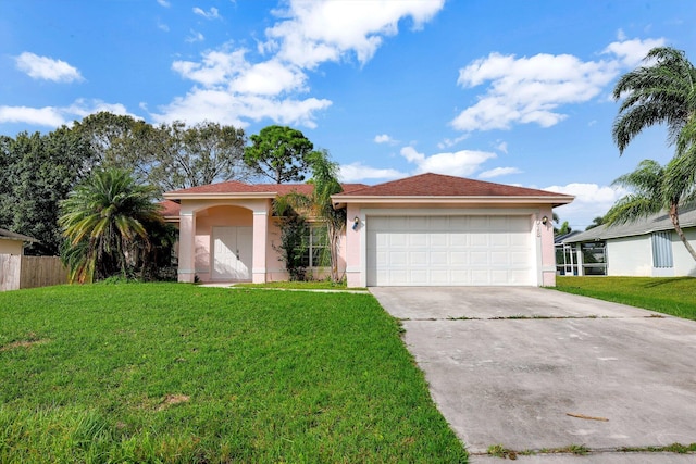 view of front facade featuring a garage and a front yard