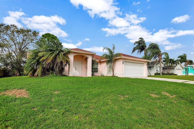 view of front of property with a garage and a front yard