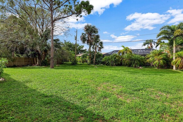 view of yard featuring a lanai