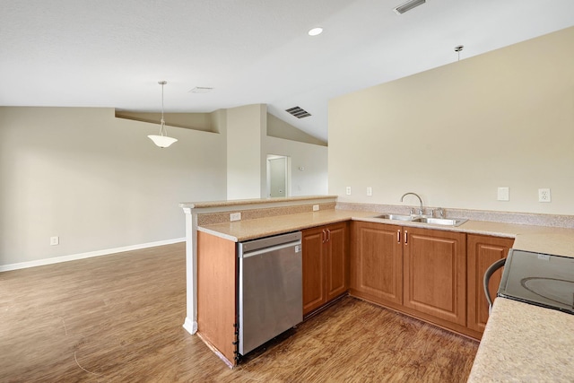 kitchen with light hardwood / wood-style floors, sink, appliances with stainless steel finishes, hanging light fixtures, and lofted ceiling