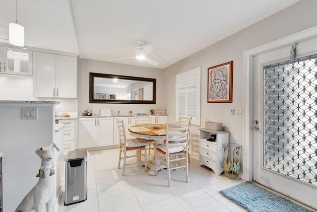 dining room with ceiling fan and light tile patterned floors