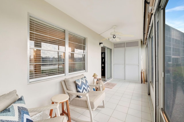 sunroom / solarium with ceiling fan