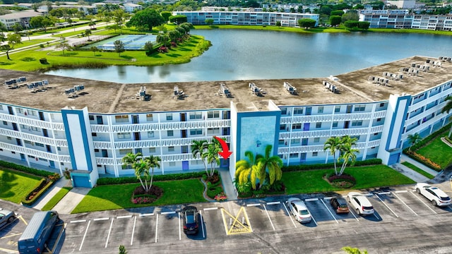 birds eye view of property with a water view