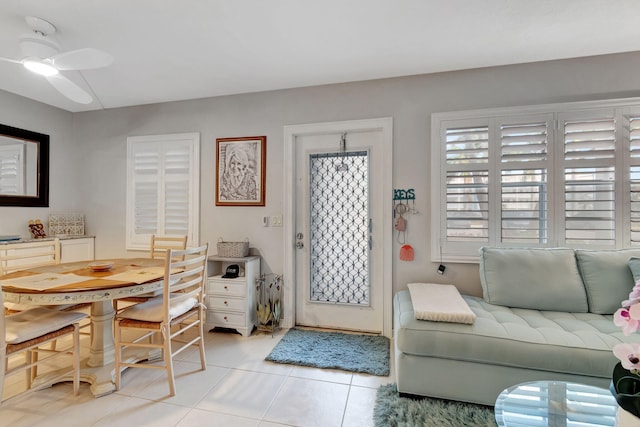 tiled living room featuring ceiling fan