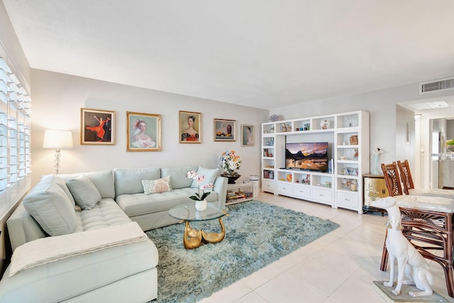 tiled living room with a wealth of natural light