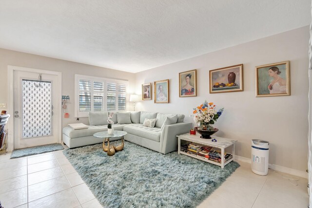 tiled living room with a textured ceiling