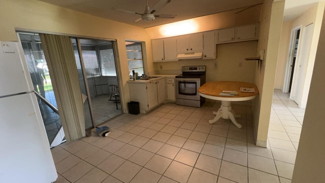 kitchen with light tile patterned flooring, range hood, white refrigerator, ceiling fan, and stainless steel electric stove