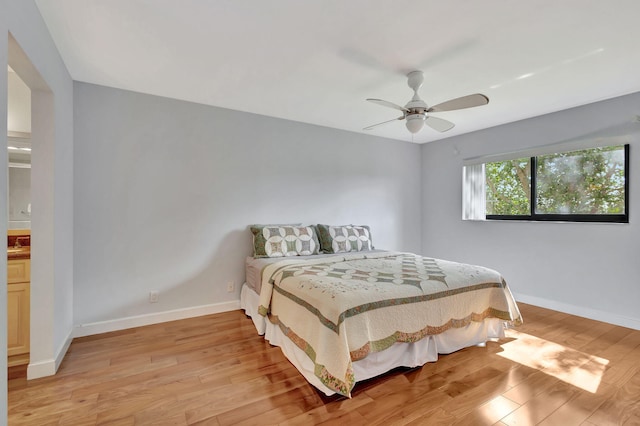 bedroom with ceiling fan and light hardwood / wood-style flooring