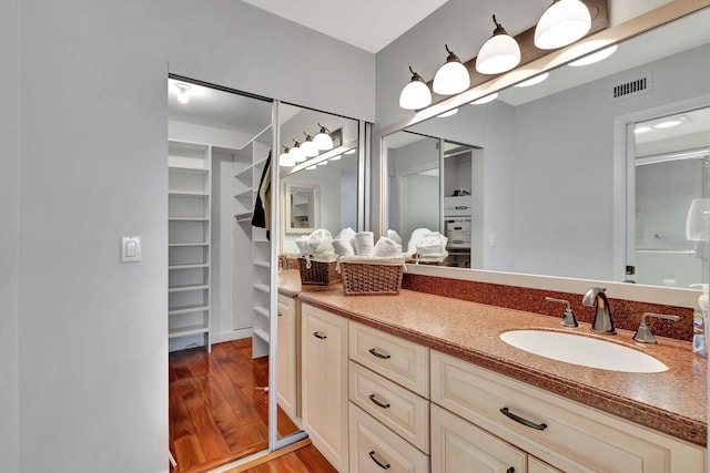 bathroom featuring vanity and hardwood / wood-style flooring