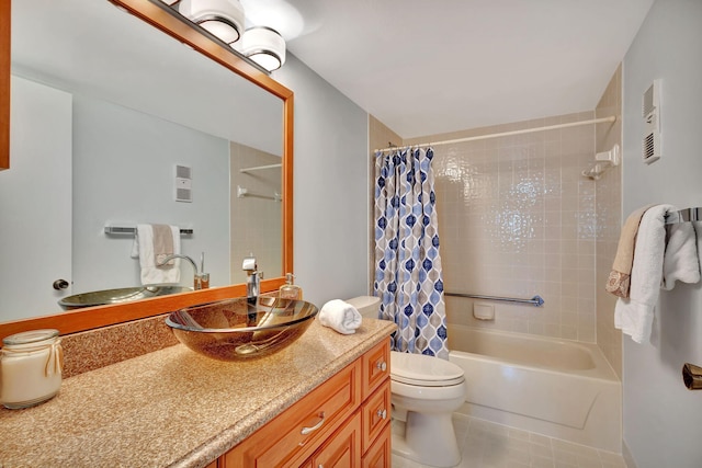 full bathroom with tile patterned floors, vanity, shower / tub combo, and toilet