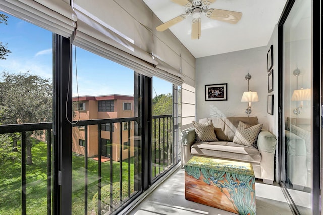 sunroom featuring ceiling fan