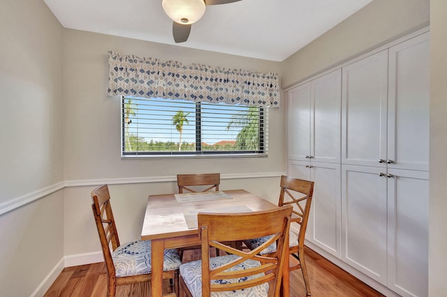 dining area with ceiling fan and light hardwood / wood-style floors