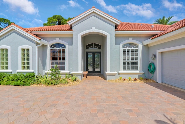 entrance to property featuring a garage