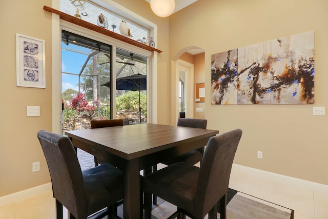 dining space featuring light tile patterned flooring