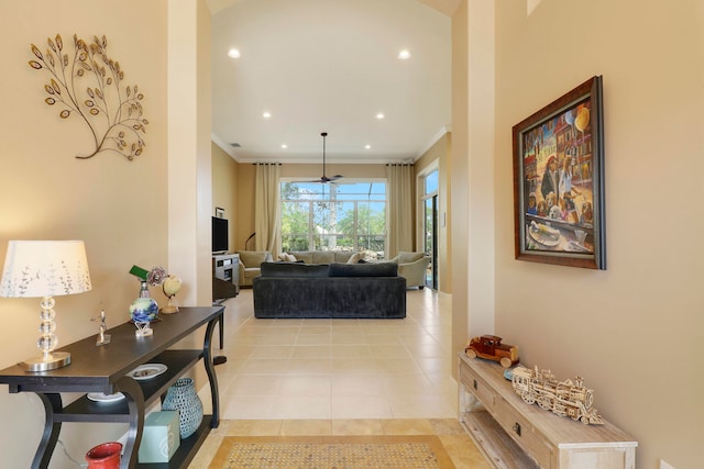 corridor featuring crown molding and light tile patterned floors