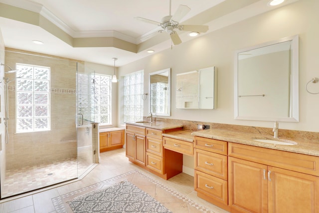 bathroom with ceiling fan, walk in shower, vanity, crown molding, and tile patterned flooring