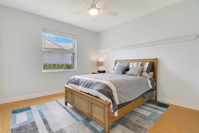 bedroom featuring light hardwood / wood-style flooring and ceiling fan